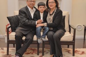 Sumita and her husband with their grandson